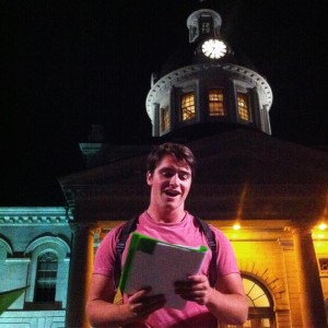 Callum Lurie rehearses Bottle and Glass out front of Kingston City Hall. 